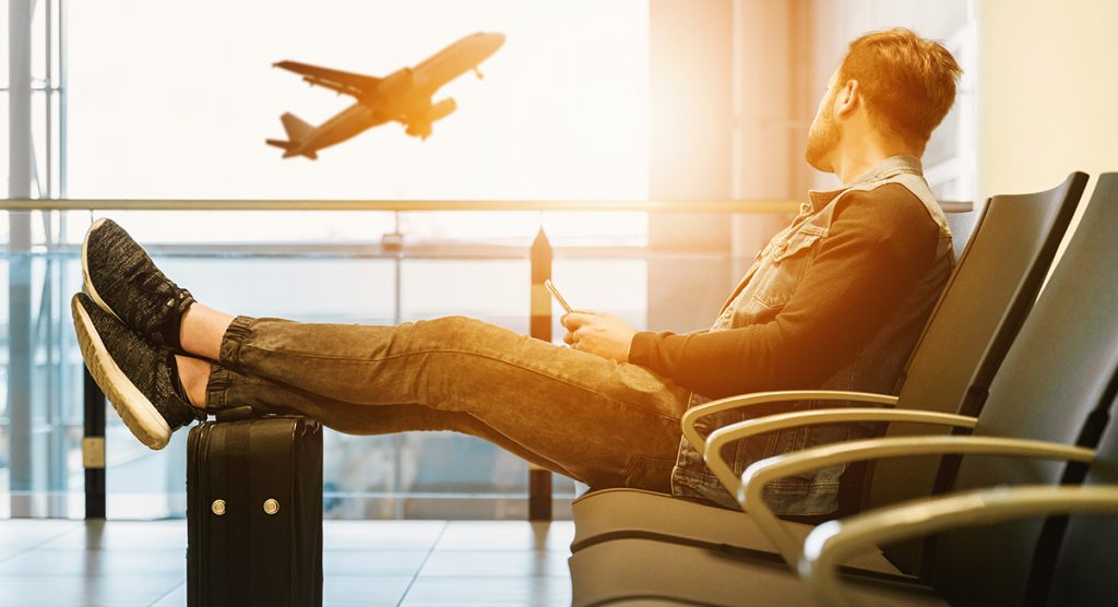 Man sitting i airport at sunset