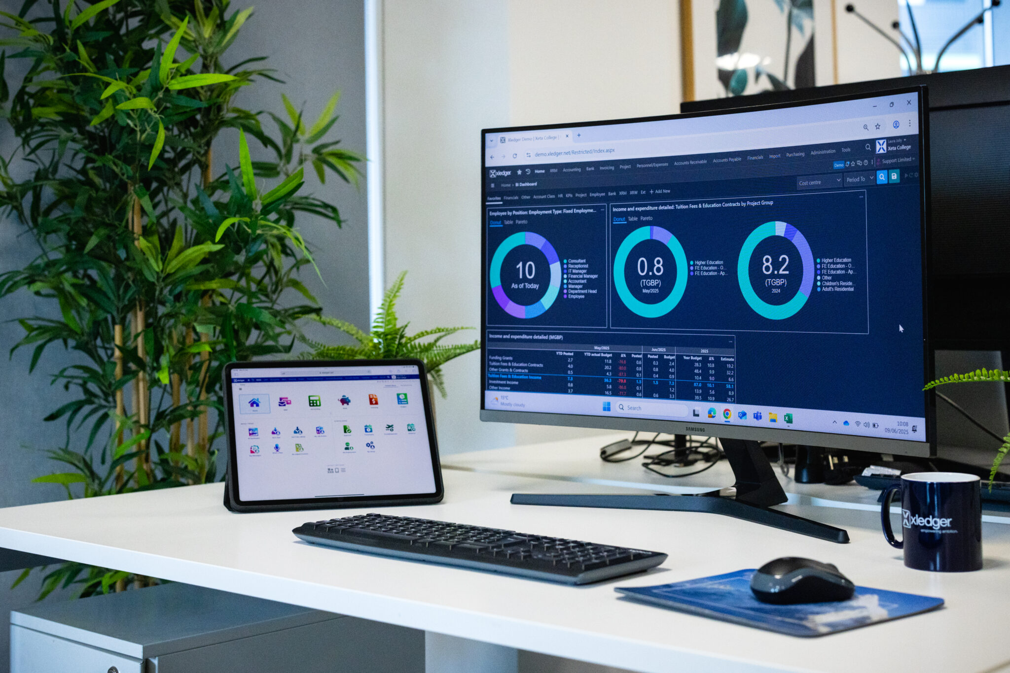 Xledger finance software on computer screen and ipad