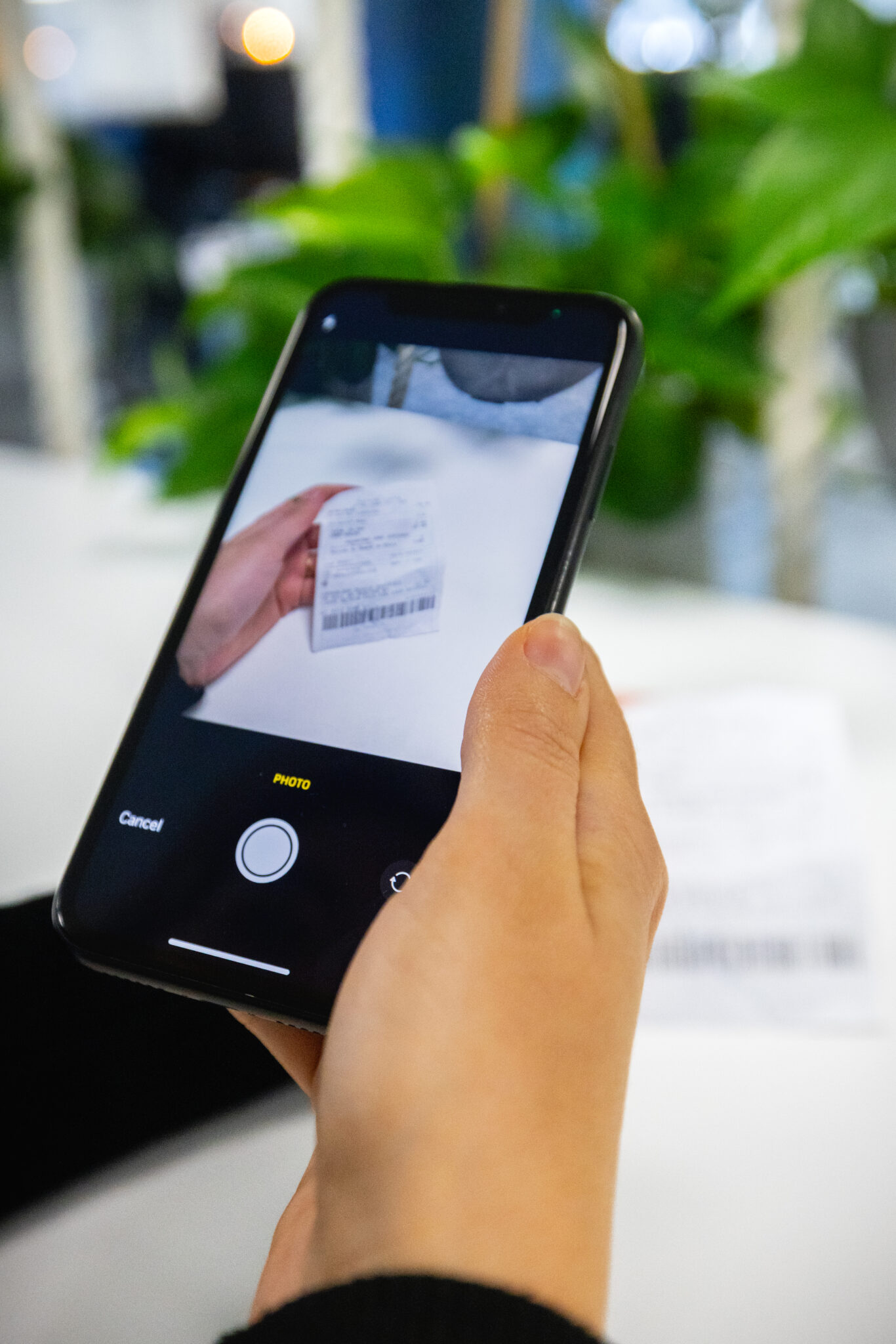 a phone taking a photo of a receipt