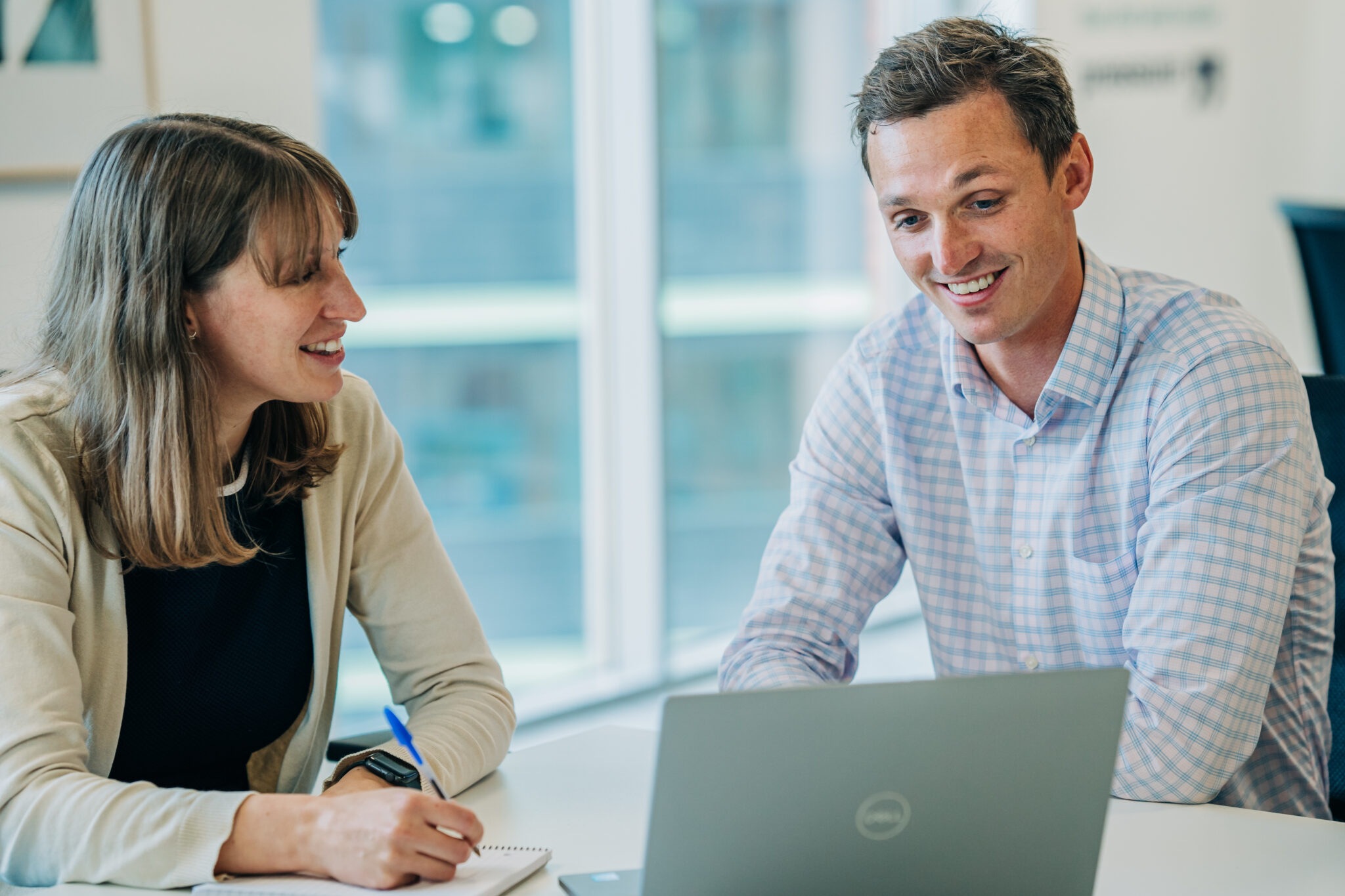 2 people looking at a computer screen
