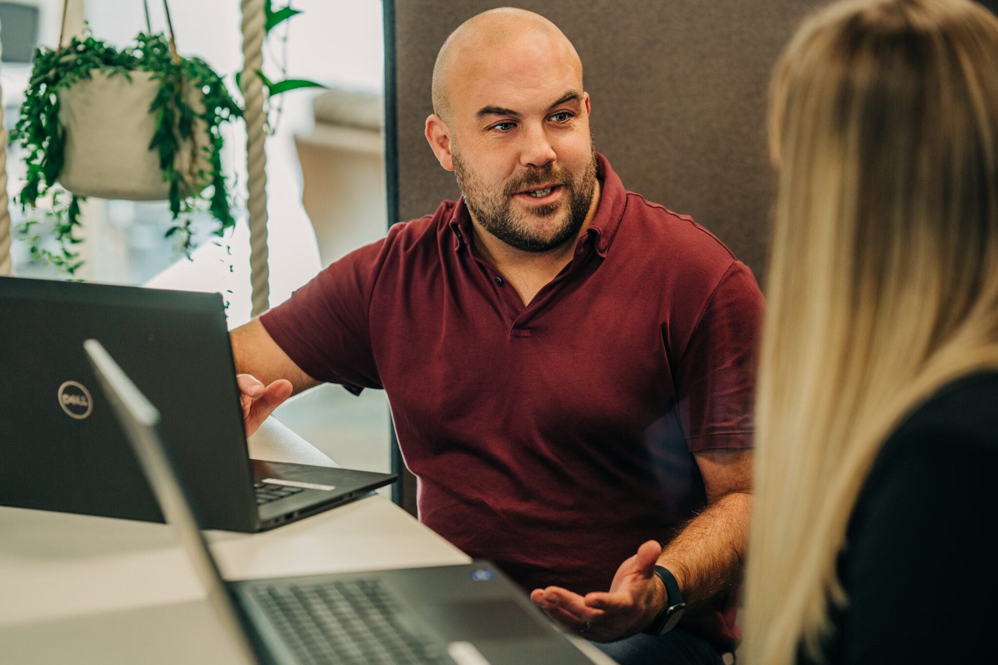 Man with computer explaining