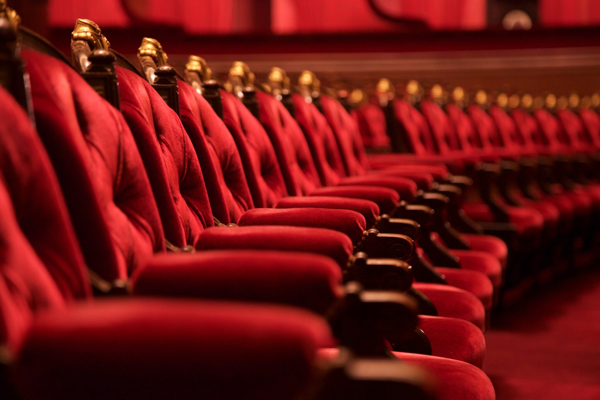 Traditional red velvet seating in a theatre
