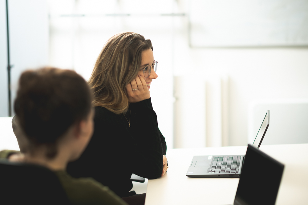 Woman smiling on laptop