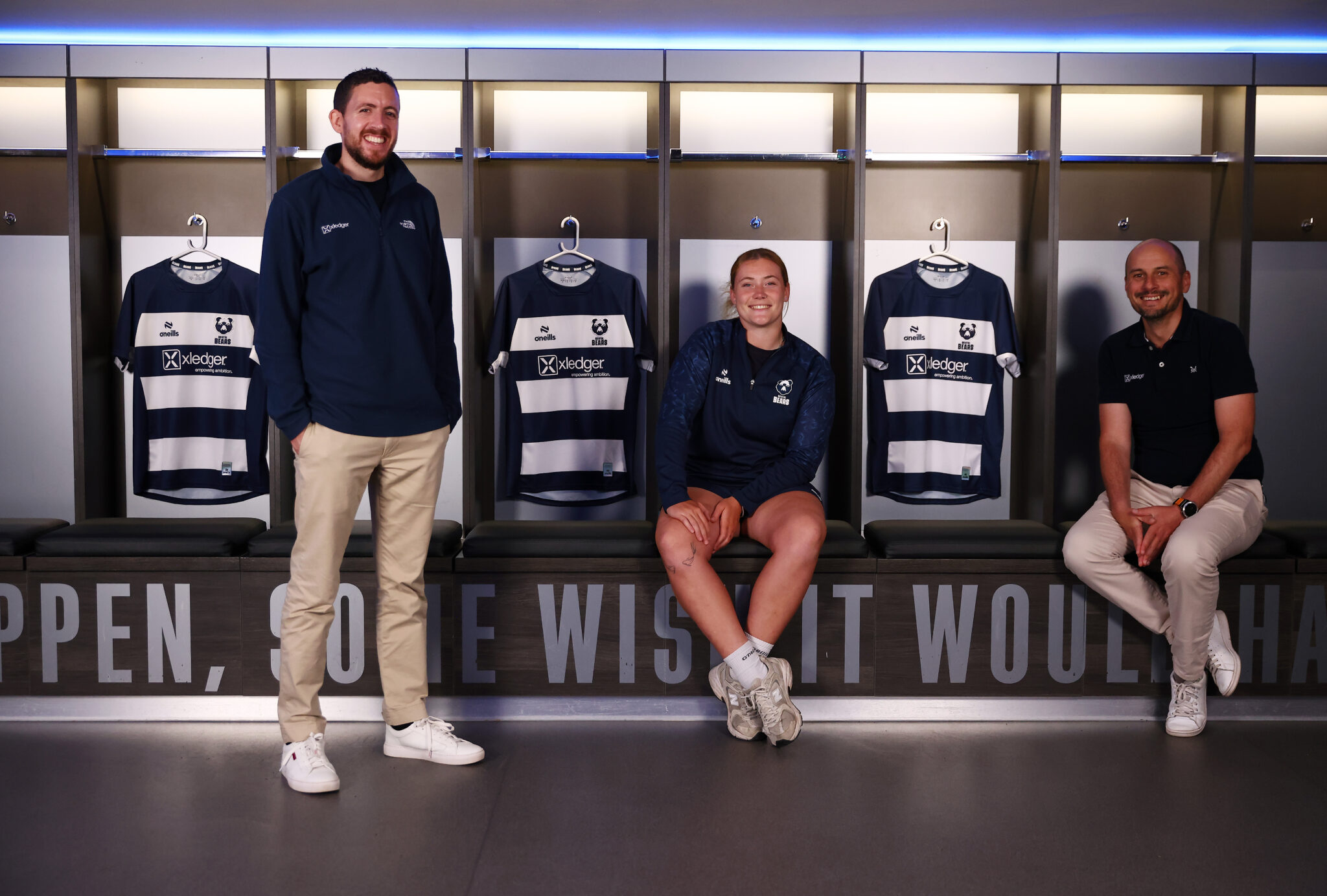 Xledger staff and Bears Womens with signed shirts