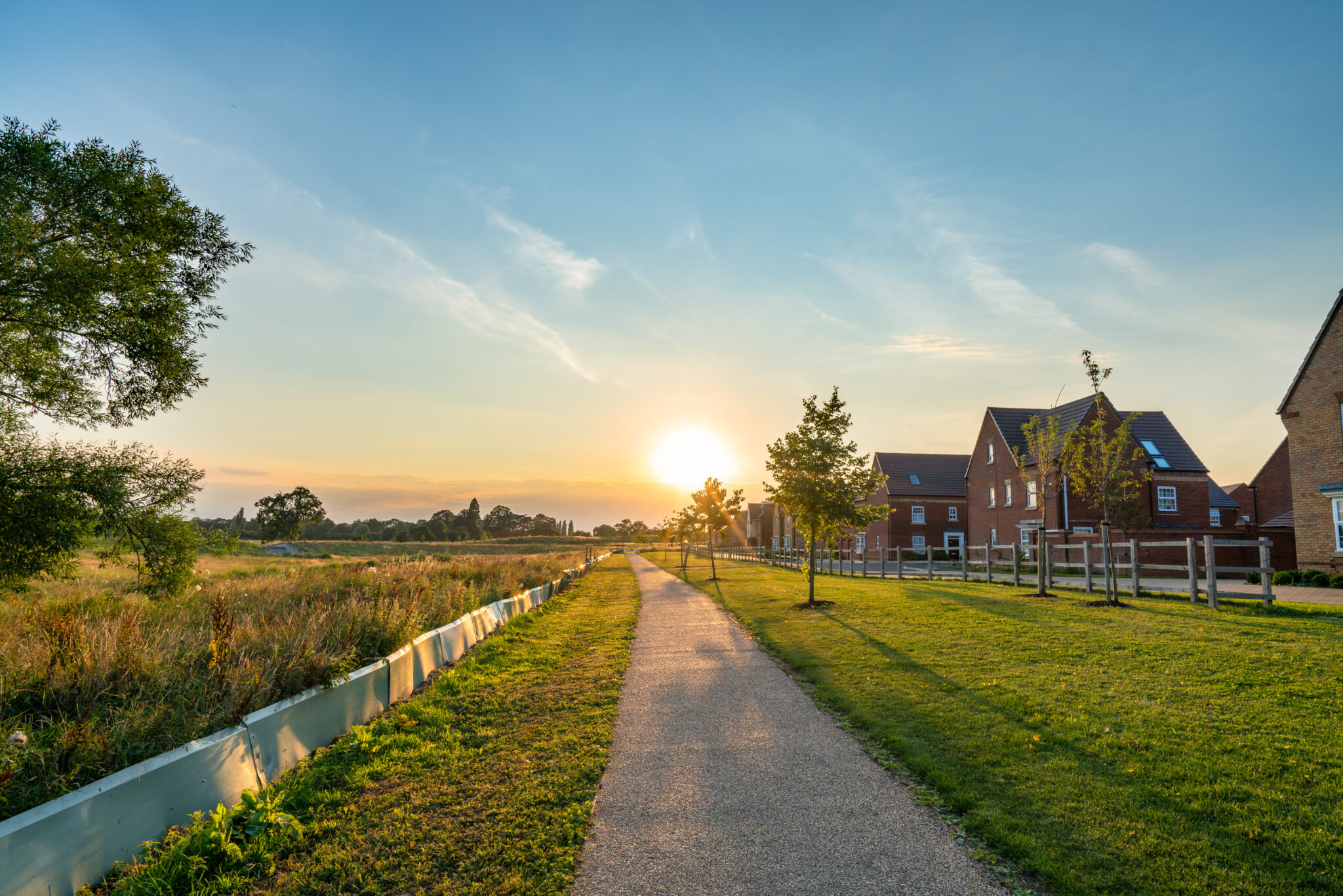 Empty walkway path at sunset near new build housing area in southern England