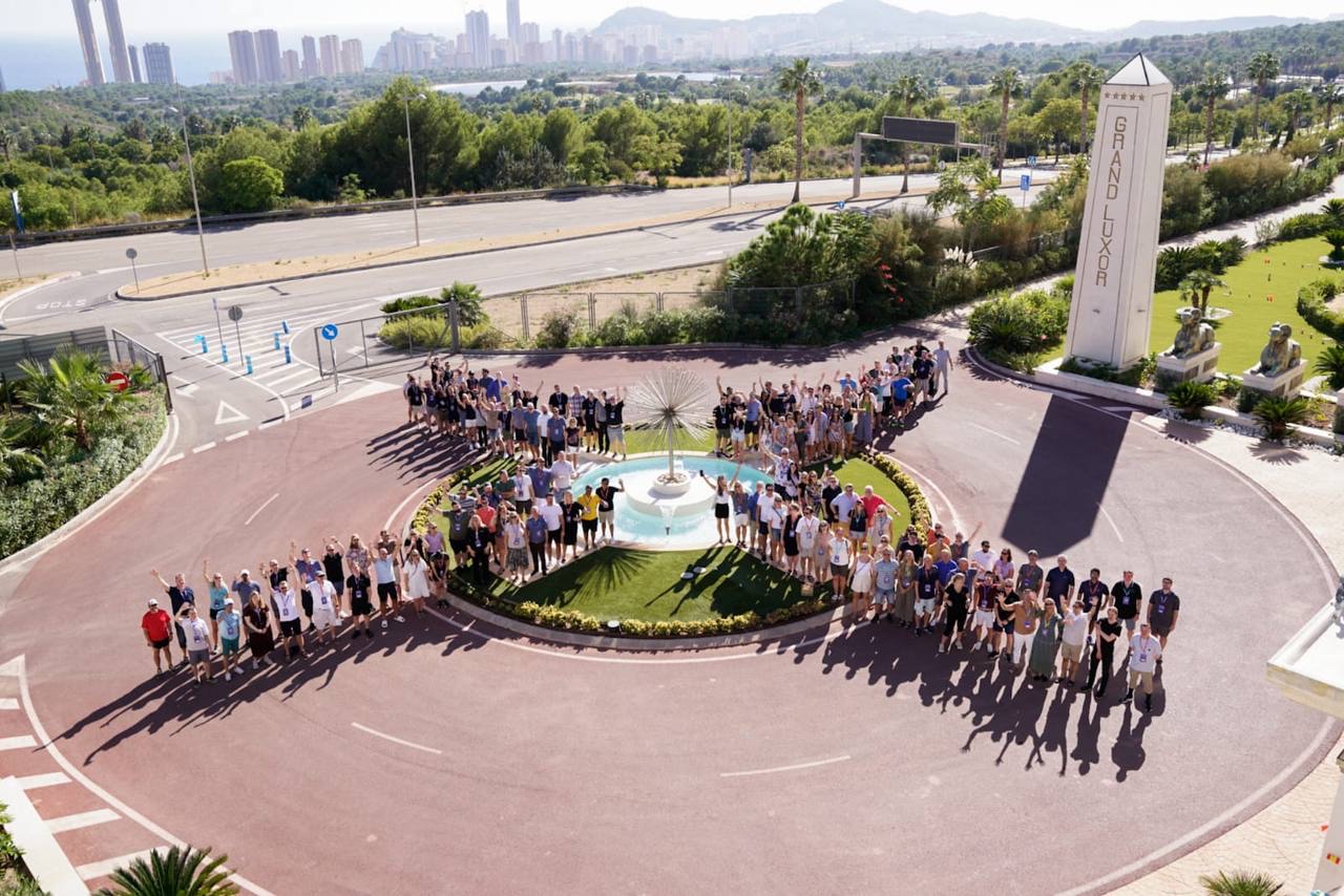 Xledger conference all staff positioned in X formation