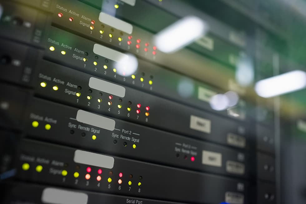 Close-up of server rack equipment with blinking status lights