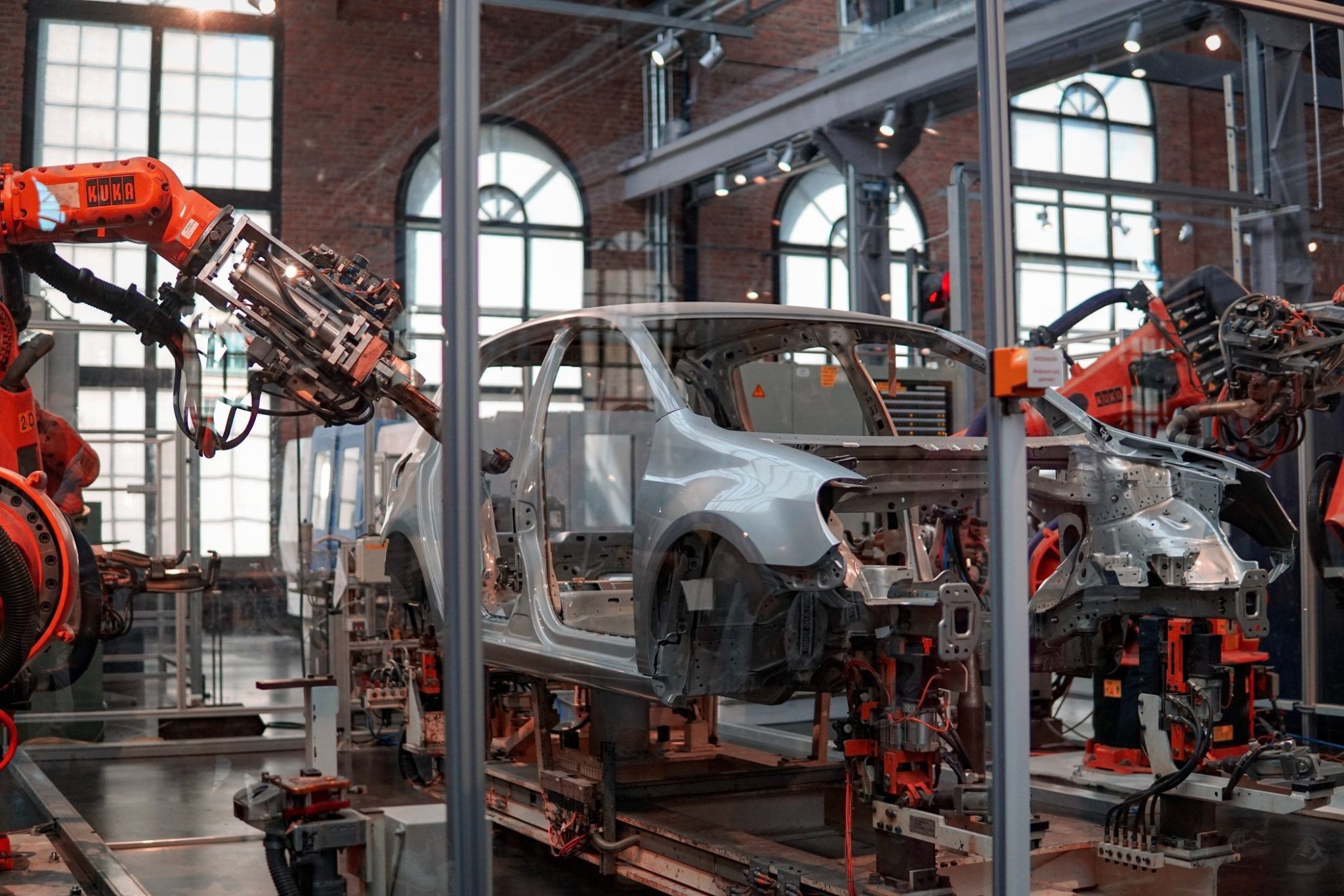 Image of a car going through a robotic assembly line