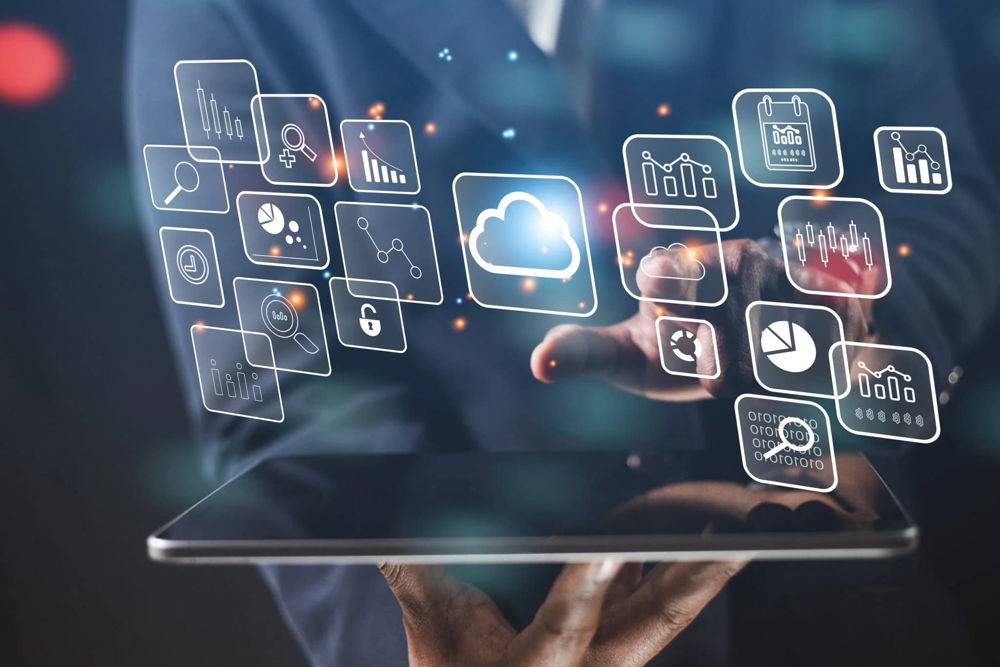 A person interacting with a tablet displaying floating cloud and data analytics icons, including charts, graphs, search, lock, and calendar symbols in a digital interface.