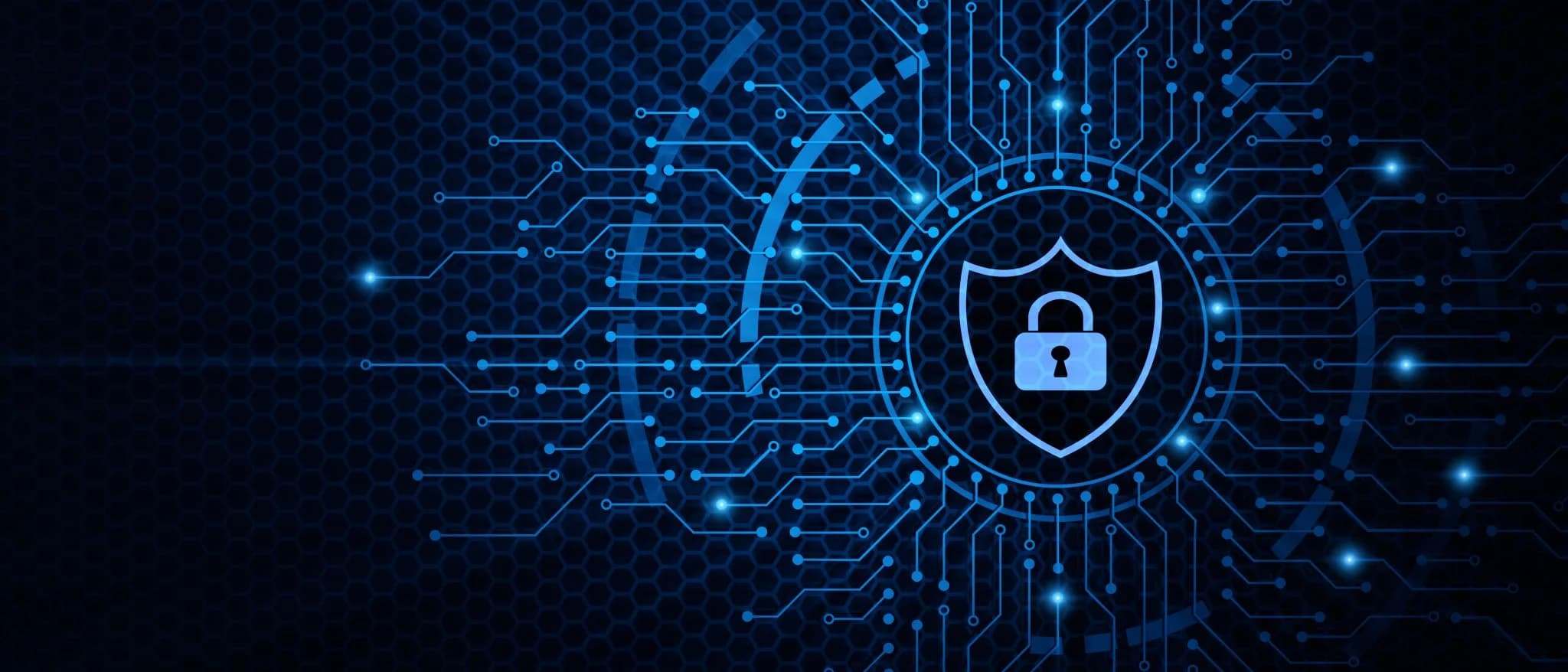 Abstract digital illustration of cybersecurity concept with a glowing shield and padlock icon surrounded by interconnected circuit lines on a dark blue hexagonal background